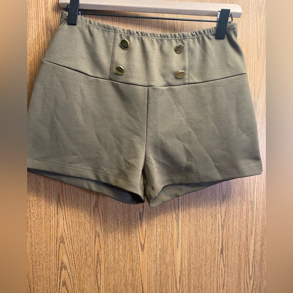 Green shorts with gold buttons
